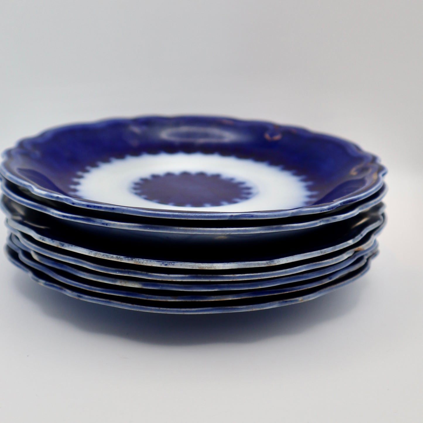 Set of (7) Antique Flow Blue 6” Plates
